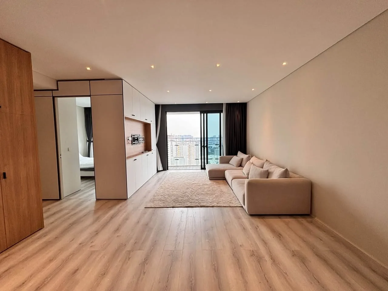 Estella Heights 2BR With Light Wood Interiors, Balcony and Bathtub