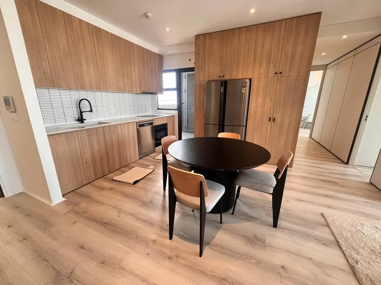 Estella Heights 2BR With Light Wood Interiors, Balcony and Bathtub