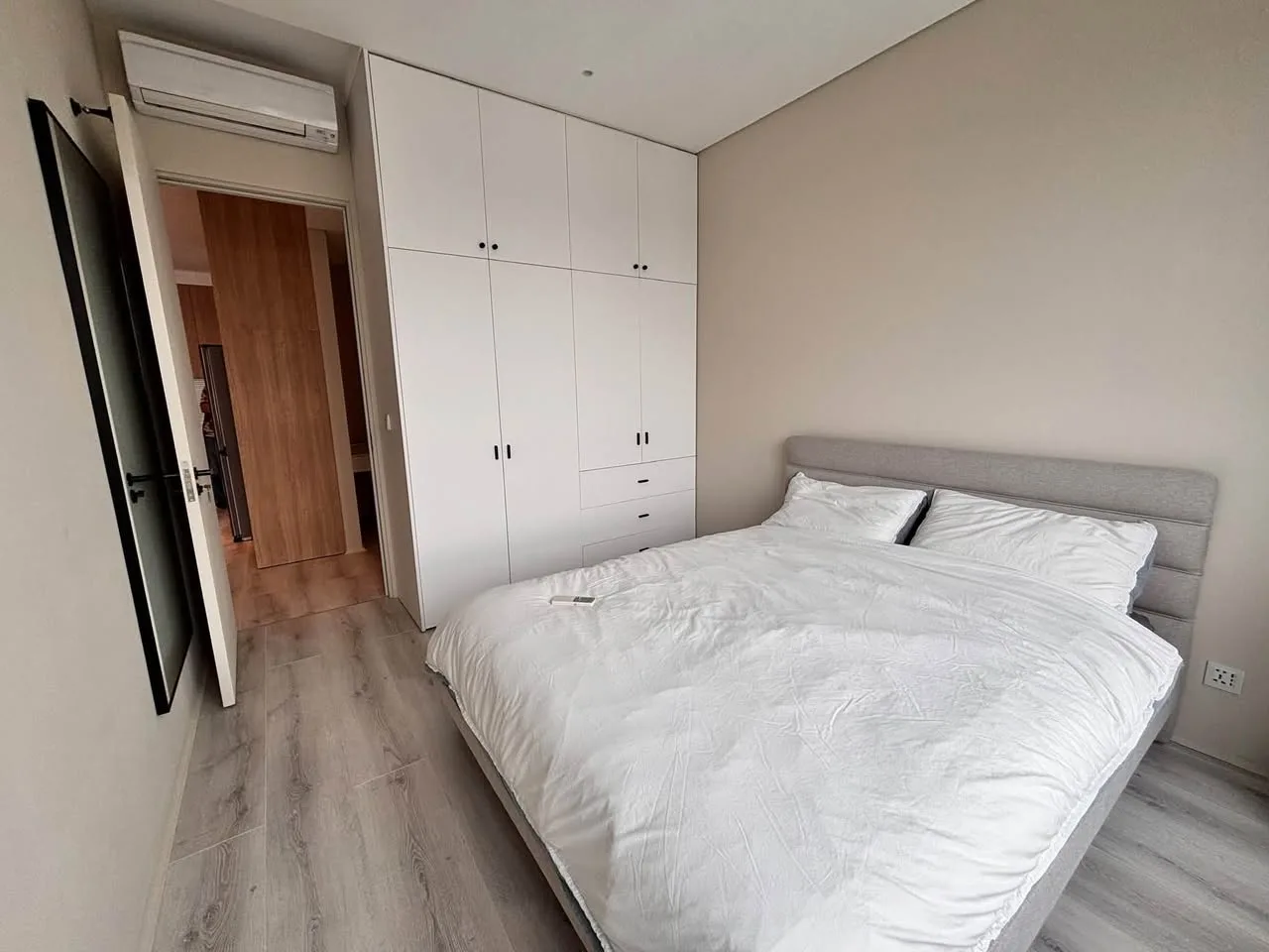 Estella Heights 2BR With Light Wood Interiors, Balcony and Bathtub