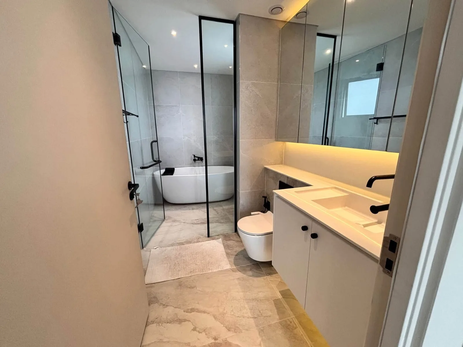 Estella Heights 2BR With Light Wood Interiors, Balcony and Bathtub